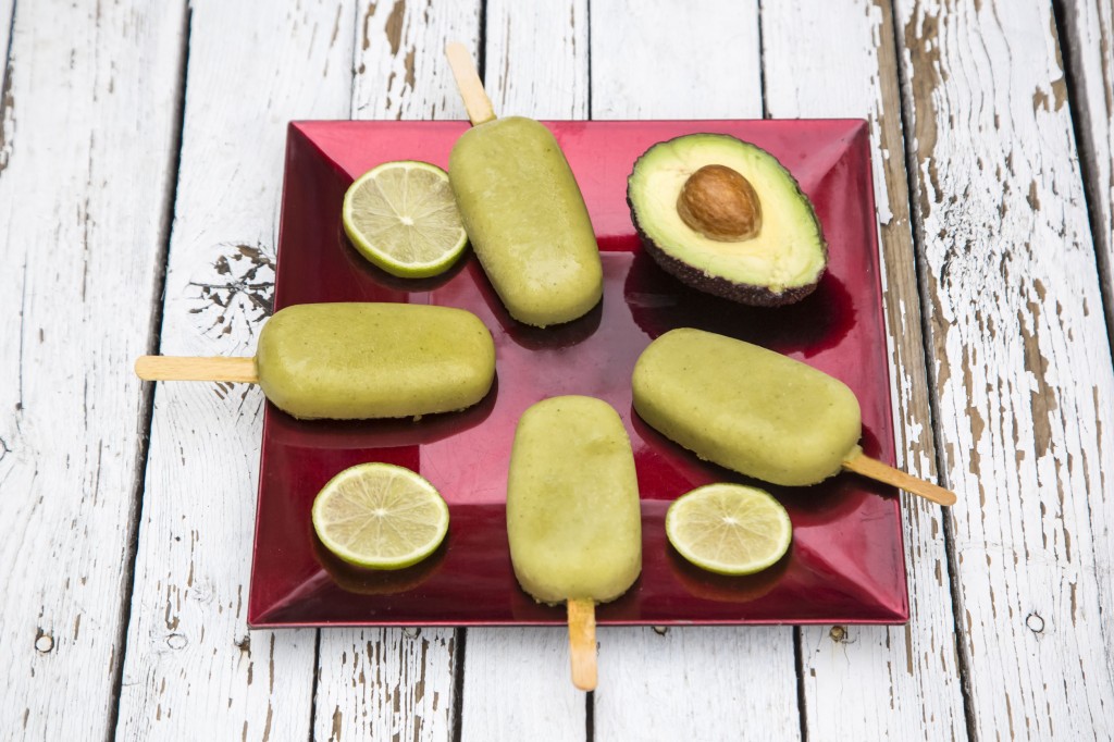 41216842 - popsicles, acocado ice, lime on plate