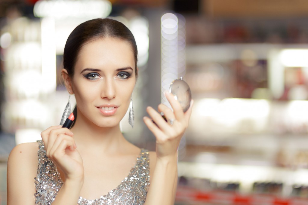 48132823 - glamour woman with lipstick and make-up mirror
