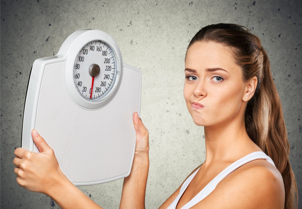 42646543 - dieting, weight scale, women.